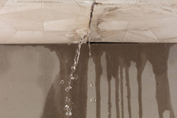 Professional Flood Damage Cleanup technician working in Chester, WV